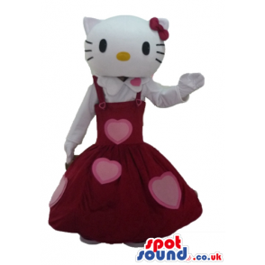 Hello kitty wearing a long sleeveless red dress with pink