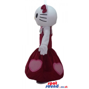 Hello kitty wearing a long sleeveless red dress with pink