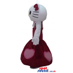 Hello kitty wearing a long sleeveless red dress with pink