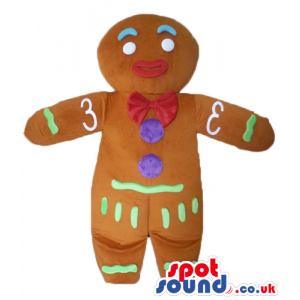 Gingerbread man with a red lace decorated in green, purple and