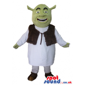 Green ogre wearing a white tunic and a brown furry vest -
