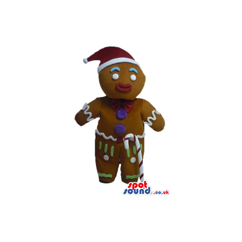 Gingerbread man colorfully decorated wearing a santa's hat and
