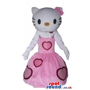 Hello kitty dressed in a long sleeveless pink dress with red