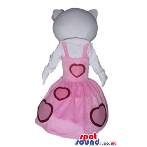 Hello kitty dressed in a long sleeveless pink dress with red