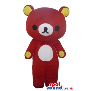 Red bear with a white nose and belly and yellow ears and paws -