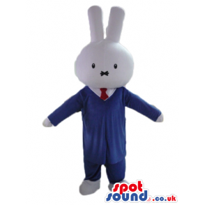 White rabbit wearing a blue suit, white shirt and red tie -