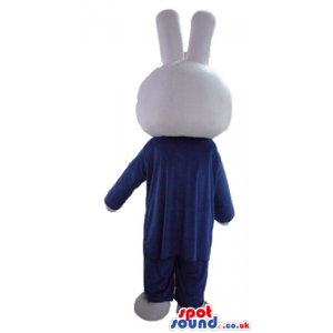 White rabbit wearing a blue suit, white shirt and red tie -