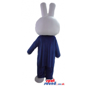 White rabbit wearing a blue suit, white shirt and red tie -