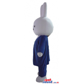 White rabbit wearing a blue suit, white shirt and red tie -