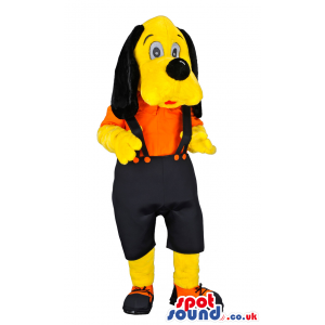 Yellow Dog Wearing Black Pants With Suspenders And Orange Shirt