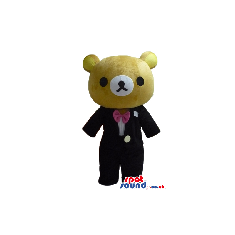 Brown bear wearing a black suit a white shirt and pink bow tie