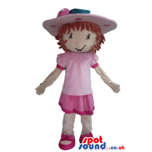 Brown-haired girl wearing a pink hat, a pink dress, white socks