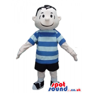 Boy with short black hair, black shorts, a striped blue and