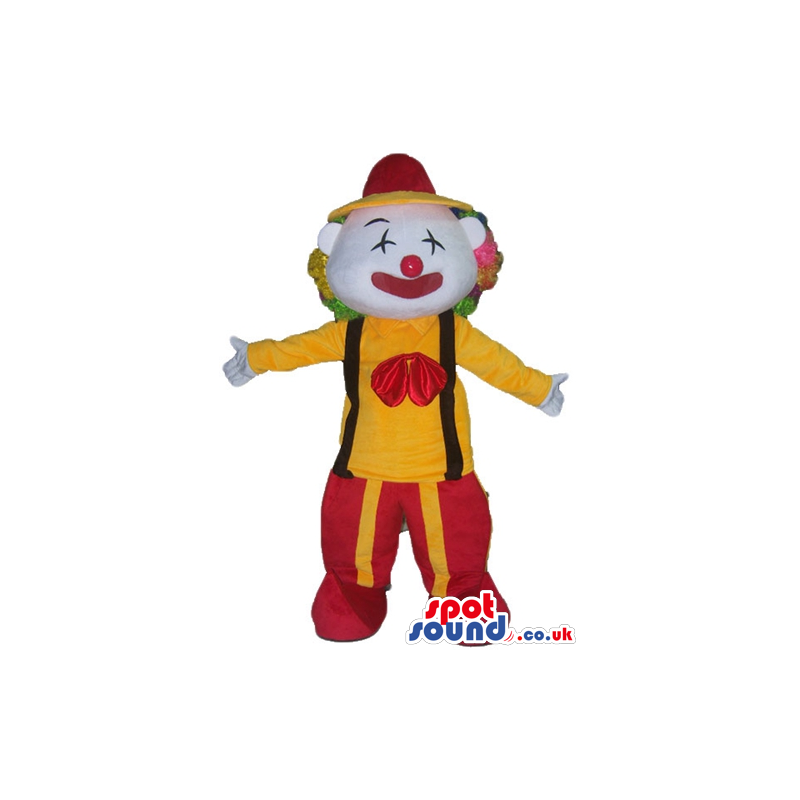 Clown with multicolored hair and a red nowse wearing a yellow