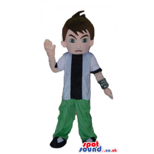 Boy wearing a black t-shirt, a white shirt, green trousers and