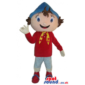 Boy wearing a red sweater, a blue hat, white trousers, red