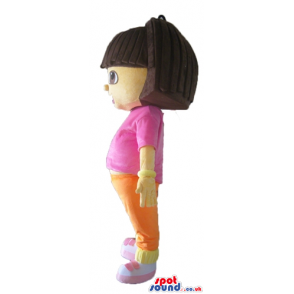 Dora the explorer wearing a pink t-shirt, orange shorts and