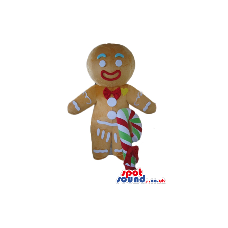 Gingerbread man colorfully decorated wearing a santa's hat and