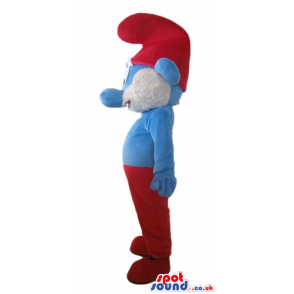 Papa smurf with a white beard, red trousers and a red hat -