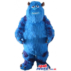 Blue monster with small eyes, sharp teeth and small brown horns