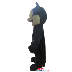 Black bat with a beige face and big yellow eyes - Custom Mascots