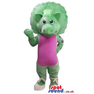 Female green dinosaur wearing a pink maillot and white