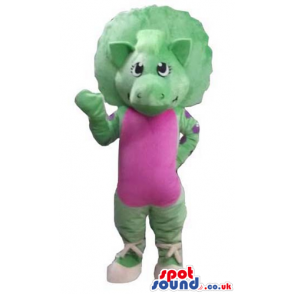 Female green dinosaur wearing a pink maillot and white