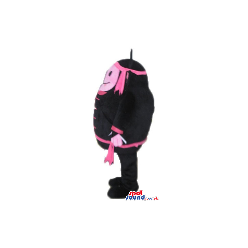 Pink monster wearing black and pink trousers, jacket and hat -