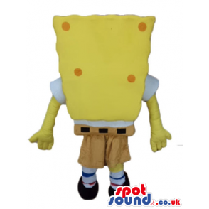 Sponge bob with orange dots wearing brown shorts, and a red tie