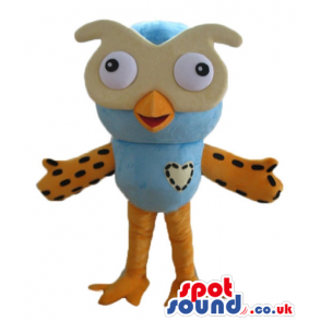 Light-blue owl with big beige eyes, orange wings and legs and a
