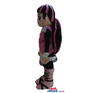 Monster high girl with long pink and black hair, wearing a pink