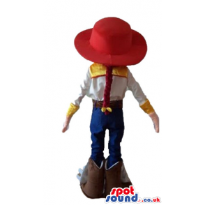 Jessie the cowgirl wearing a red hat, a white shirt, blue