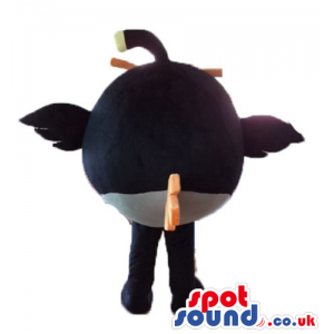 Black angry bird with thick orange eyebrows and a yellow beak -