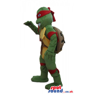 Ninja turtle with a yellow belly, a red mask round the eyes and