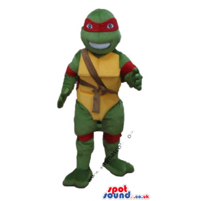 Ninja turtle with a yellow belly, a red mask round the eyes and