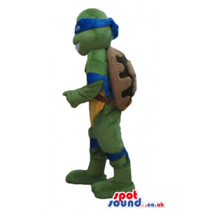 Ninja turtle with a yellow belly, a blue mask round the eyes