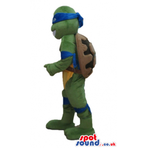 Ninja turtle with a yellow belly, a blue mask round the eyes