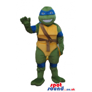 Ninja turtle with a yellow belly, a blue mask round the eyes