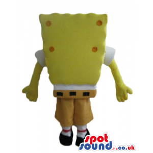 Sponge bob with orange dots wearing brown shorts, and a red tie