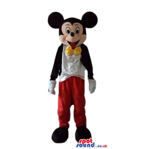 Mickey wearing red trousers, a white shirt, a black jacket and