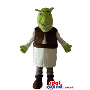 Green ogre wearing a white tunic and a brown furry vest -