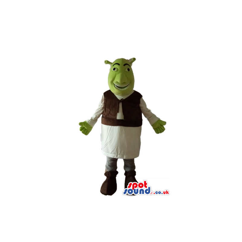 Green ogre wearing a white tunic and a brown furry vest -