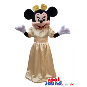Minnie mouse wearing a creamy silky long dress and a creamy bow