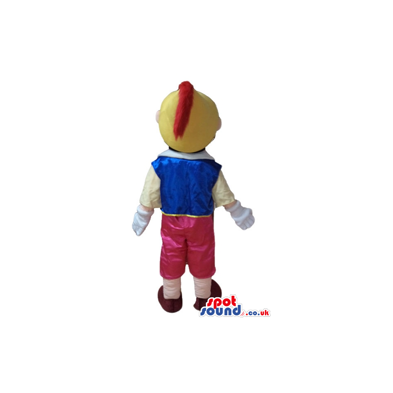 Pinnochio wearing red trousers, a yellow shirt, a blue vest, a