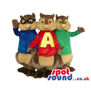 Three brown squirrels wearing a red sweater, a green sweater
