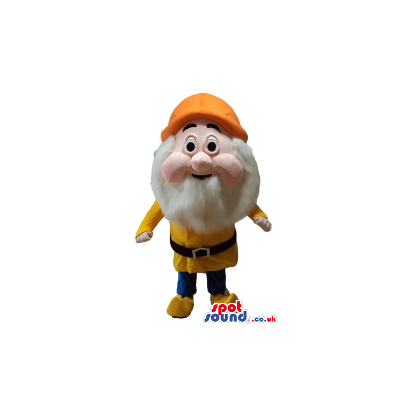 Elf with a long white beard wearing a yellow sweater and shoes