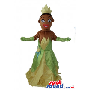 Black princess wearing a long yellow and green dress and a