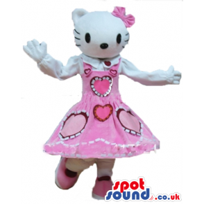 Hello kitty wearing a long sleeveless red dress with pink