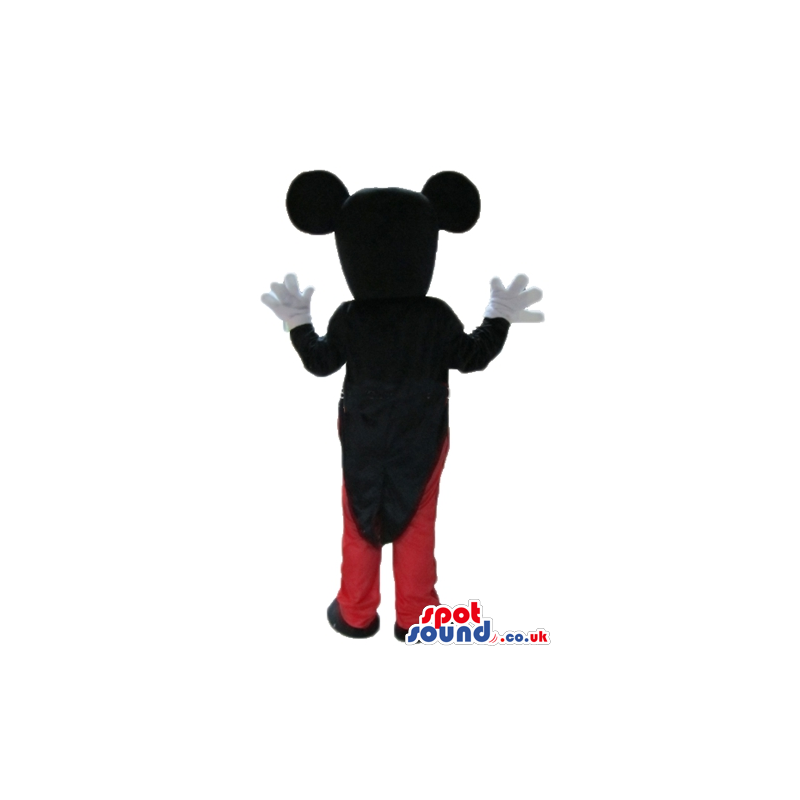 Mickey mouse wearing a black jacket red trousers, a white shirt