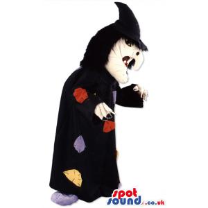 Witch mascot with typical witch hat and in black cloak